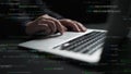 Hands Typing on Laptop Keyboard Surrounded by Lines of Code in a Dark Environment Representing Programming and Software Royalty Free Stock Photo