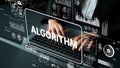 Hands typing on laptop with overlay graphics displaying data analytics concepts such as algorithms and technology in a Royalty Free Stock Photo