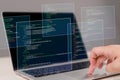 Hands typing on laptop with programming code on screen, representing software development. Perfect for coding, IT solutions, Royalty Free Stock Photo