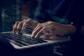 Hands typing on laptop with programming code on screen, representing software development. Perfect for coding, IT solutions, Royalty Free Stock Photo