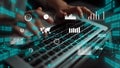 Hands Typing on Laptop Surrounded by Data Visualizations and Statistical Graphics with Binary Code Elements in the Royalty Free Stock Photo