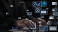 Hands typing on a laptop surrounded by digital graphics and data visualizations illustrating technology and data Royalty Free Stock Photo