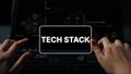 Hands Typing on Laptop with Tech Stack Graphics Displaying Complex Technology Concepts and Data Visualization Elements Royalty Free Stock Photo