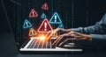 Hands typing on laptop with vibrant cyber security alert icons and binary code background for business technology concepts Royalty Free Stock Photo