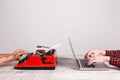 Old typewriter and laptop on table. Concept of technology progress Royalty Free Stock Photo