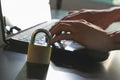 Hands typing over the keyboard on laptop. Padlock on laptop computer security Royalty Free Stock Photo