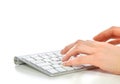 Hands typing on the remote wireless computer keyboard Royalty Free Stock Photo