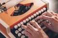 Hands typing on a retro typewriter. Business concepts. Retro picture style. Royalty Free Stock Photo