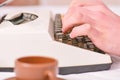 Hands typing retro writing machine. Old typewriter and authors hands. Male hands type story or report using white Royalty Free Stock Photo