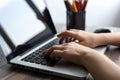 Hands typing on silver white laptop computer keyboard close up Royalty Free Stock Photo