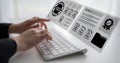 Hands typing on a white keyboard with floating digital documents, certificates, and a globe symbolizing technology Royalty Free Stock Photo