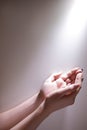 Hands glowing light god grace fervent prayer Royalty Free Stock Photo