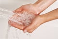 Hands under a stream of shower Royalty Free Stock Photo