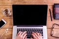 Hands of unrecognizable man working on laptop, writing. Royalty Free Stock Photo