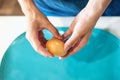 The hands of an unrecognizable woman peel a boiled egg. The process of cleaning eggs. Woman preparing Breakfast. Photo of beautif