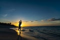 Hands up woman posing on the beach with beautiful sunset sky, clouds background. Free space for text. Cuba Varadero Yoga Royalty Free Stock Photo