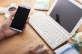 hands using cell phone and laptop on desk wood and Business work Royalty Free Stock Photo