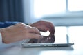 Hands using digital white tablet computer