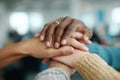 Diverse group of hands, including dark and light skin tones, stacked together in unity, symbolizing teamwork, collaboration, and Royalty Free Stock Photo