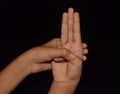 Hands in Varuna Mudra isolated on black background. Royalty Free Stock Photo