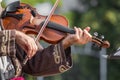 Hands of violinist and violin during an open air concert_ Royalty Free Stock Photo