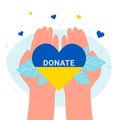 Hands of volunteer holding yellow blue heart in colors of Ukrainian flag and Donate word Royalty Free Stock Photo