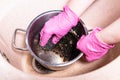 Hands wash pan with burnt food with metal sponge