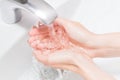 Hands wash with water in white sink. retouched conseptual photo of purity Royalty Free Stock Photo