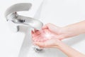 Hands wash with water in white sink. retouched conseptual photo of purity Royalty Free Stock Photo