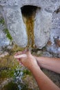 Hands washing under water source