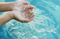 Hands in water