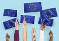 Hands waving flags of the EuropeanUnion Royalty Free Stock Photo