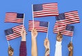 Hands waving flags of the United States