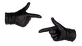 Hands wearing black leather gloves make the finger guns or pointing gesture, view from front and back.  Female hand isolated Royalty Free Stock Photo