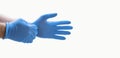 Hands wearing blue medical latex gloves Protection against flu, virus and coronavirus. Health care and surgical concept. Correct