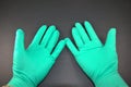 Hands wearing gloves as PPE