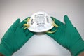 Hands wearing sterile gloves holding N95 Respirator Royalty Free Stock Photo