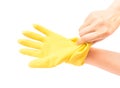 Hands wearing yellow rubber gloves for cleaning on white background, workhouse concept