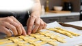 Hands Weaving Lattice Pattern from Dough for Pie Crust Royalty Free Stock Photo