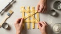 Hands Weaving Lattice Pattern with Dough Strips for Pie Crust Royalty Free Stock Photo