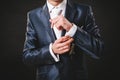 Hands of wedding groom getting ready in suit