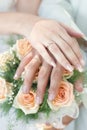 Hands with wedding rings