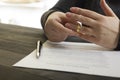 Hands of wife, husband signing decree of divorce, dissolution, canceling marriage, legal separation documents, filing Royalty Free Stock Photo