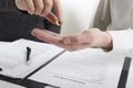 Hands of wife, husband signing decree of divorce, dissolution, canceling marriage, legal separation documents, filing Royalty Free Stock Photo