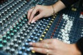 Hands of a woman are adjusting music mixer Royalty Free Stock Photo