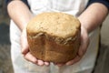 Hands of woman baker with bread