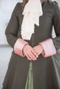 Hands of woman in beautiful vintage medieval frock-coat