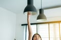 Hands woman changing with new LED lamp light bulb Royalty Free Stock Photo