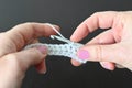 Hands of a woman crocheting with crochet needle