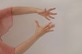 Hands of a woman dancing flamenco dance on a white background